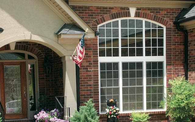 Arched windows on a brick home
